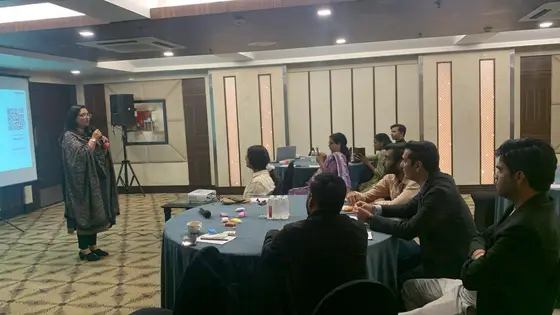 Neha Goel leading a corporate training session